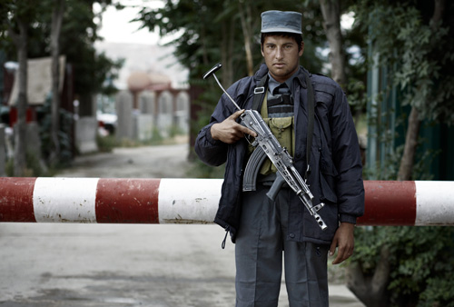 Afghan isaf guard jallabad road Kabul portrait © by photographer Kenneth Rimm Afghan isaf guard jallabad road Kabul portraits of afghanistan by photographer Kenneth Rimm